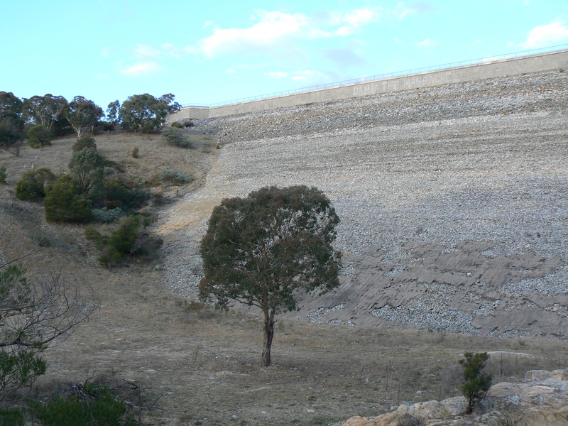 After walking along the path to the base of the dam wall, this is a view of the left side of the dam wall, and part of the old eroded spillway