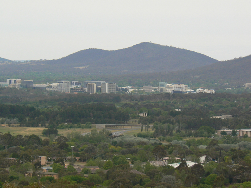 Overlooking Lyons towards Civic, with Adelaide Avenue and the Cotter Road overpass, plus The Mint.

Mount Majura is prominent in the background, with Mount Ainslie sweeping out of view to the right.