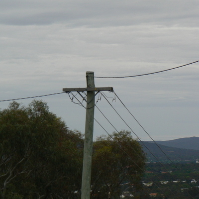 The powerlines continue around the hill