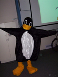 Tux visited LCA, he was originally standing on one foot, but the camera took a bit too long to get ready to take the photo. Tux almost got a laptop!