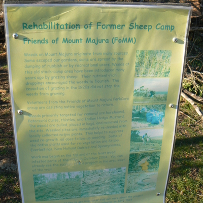 A sign at the path intersection promoting the preservation of Mount Majura.
The sign is quite faded, which indicates it has been there a while.