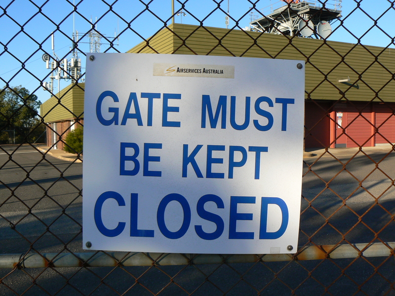 Sign on the fence of the Mount Majura Radar Complex.
The logo on this one is very faded, and only appears to contain the yello "S" symbol from the middle of the logo.