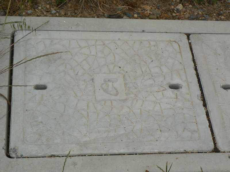A Telstra pit cover.